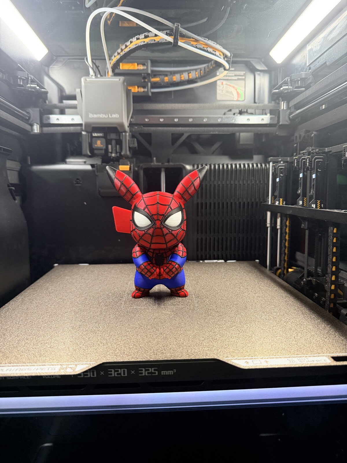 Red and blue pig hero character figure with web details
