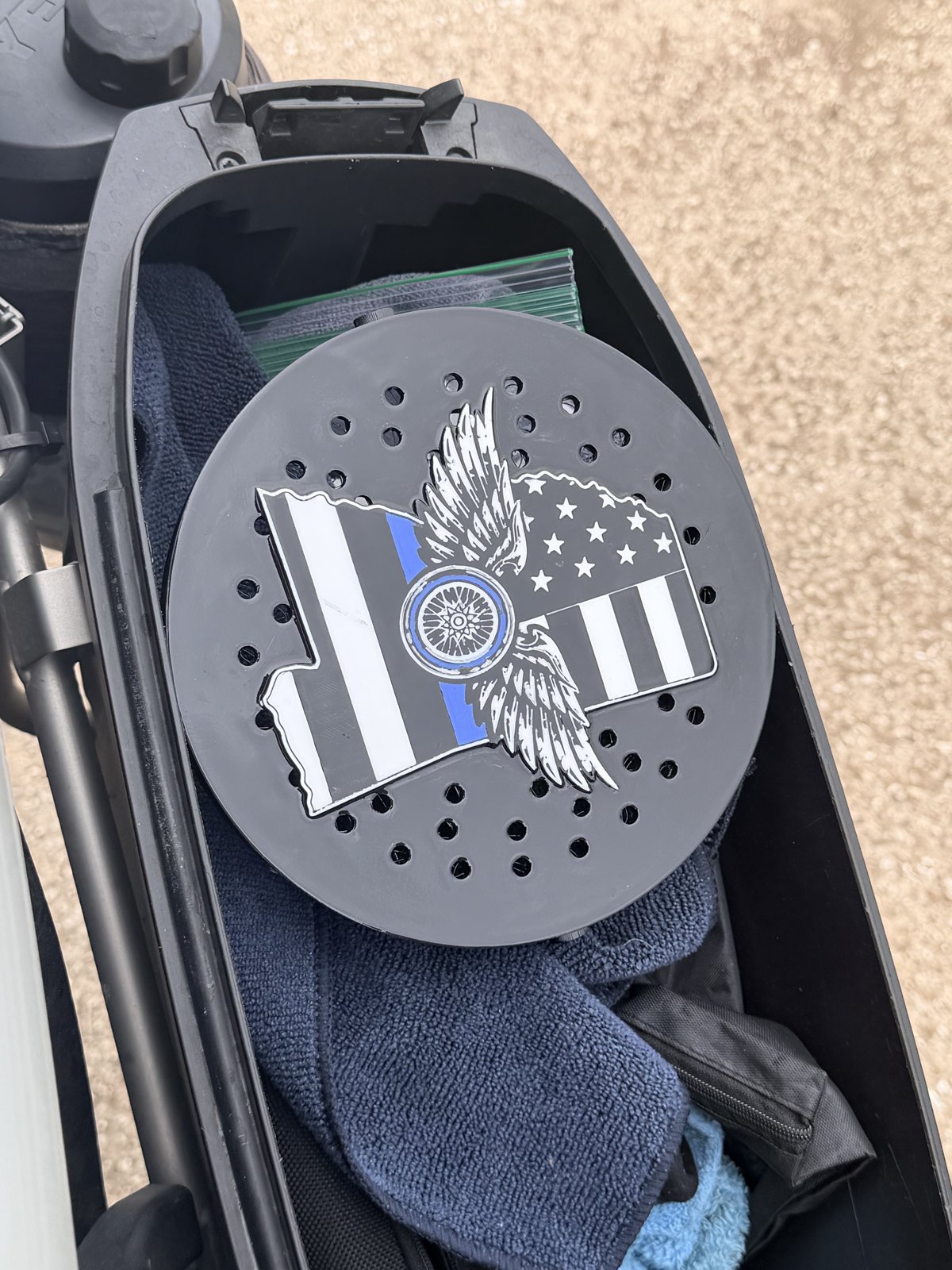 Back of a custom siren cover showing its mounting and vent openings