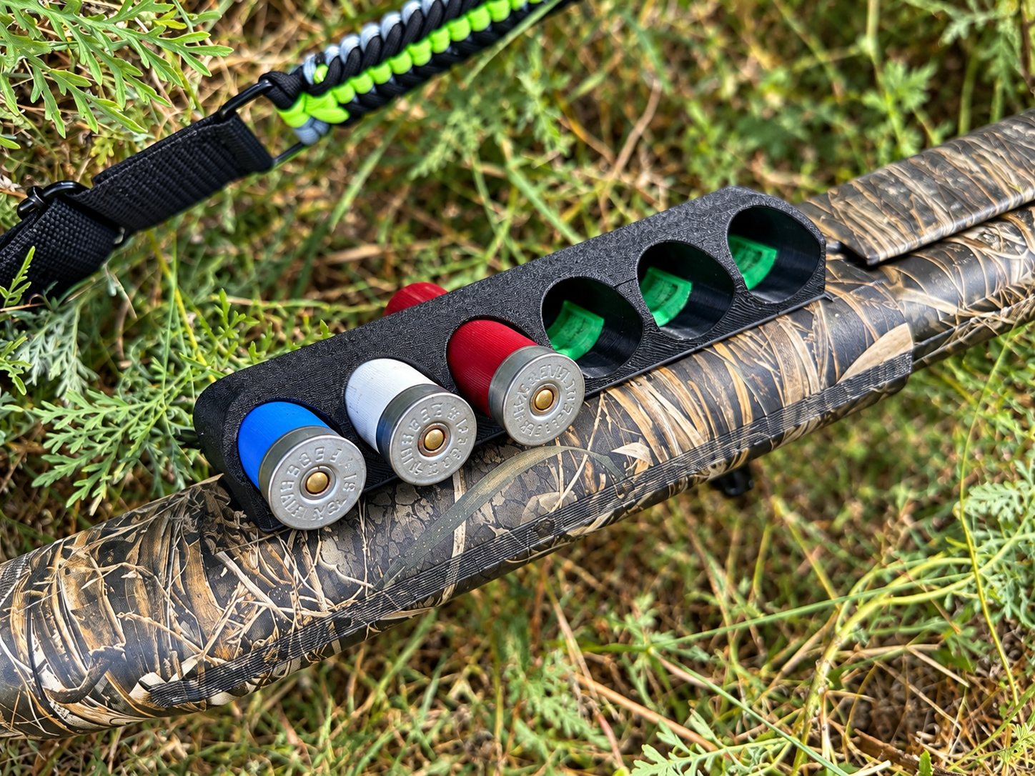 Black and green custom holder with colorful fittings outdoors