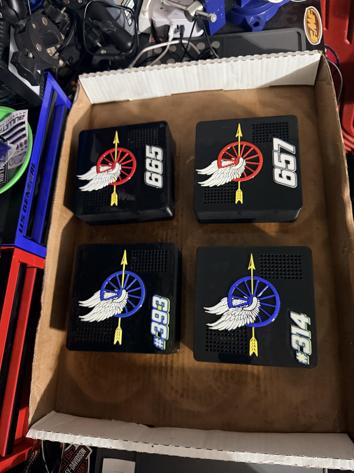 Four custom police unit siren covers in a box