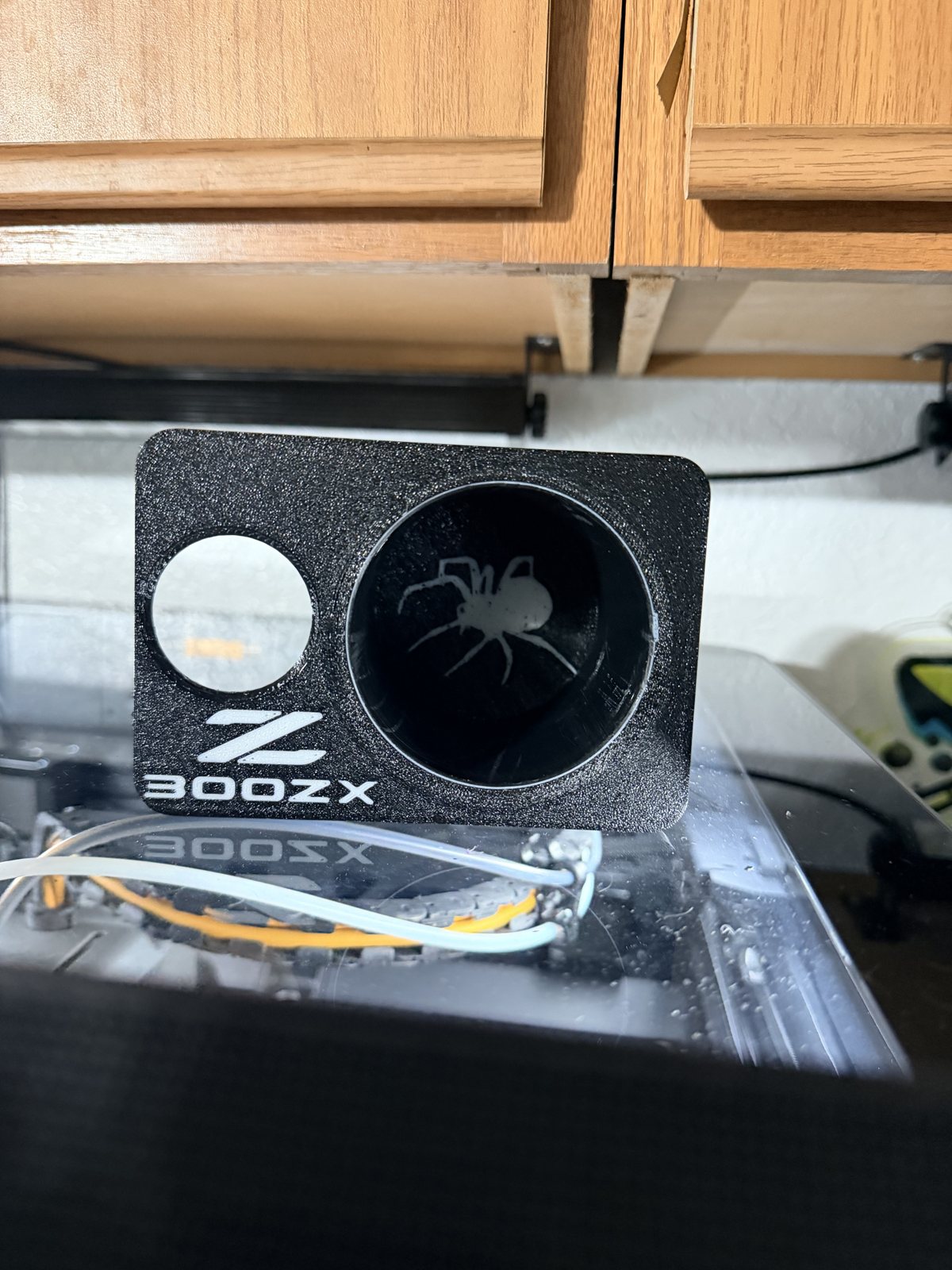 Black printed fan shroud with a circular vent