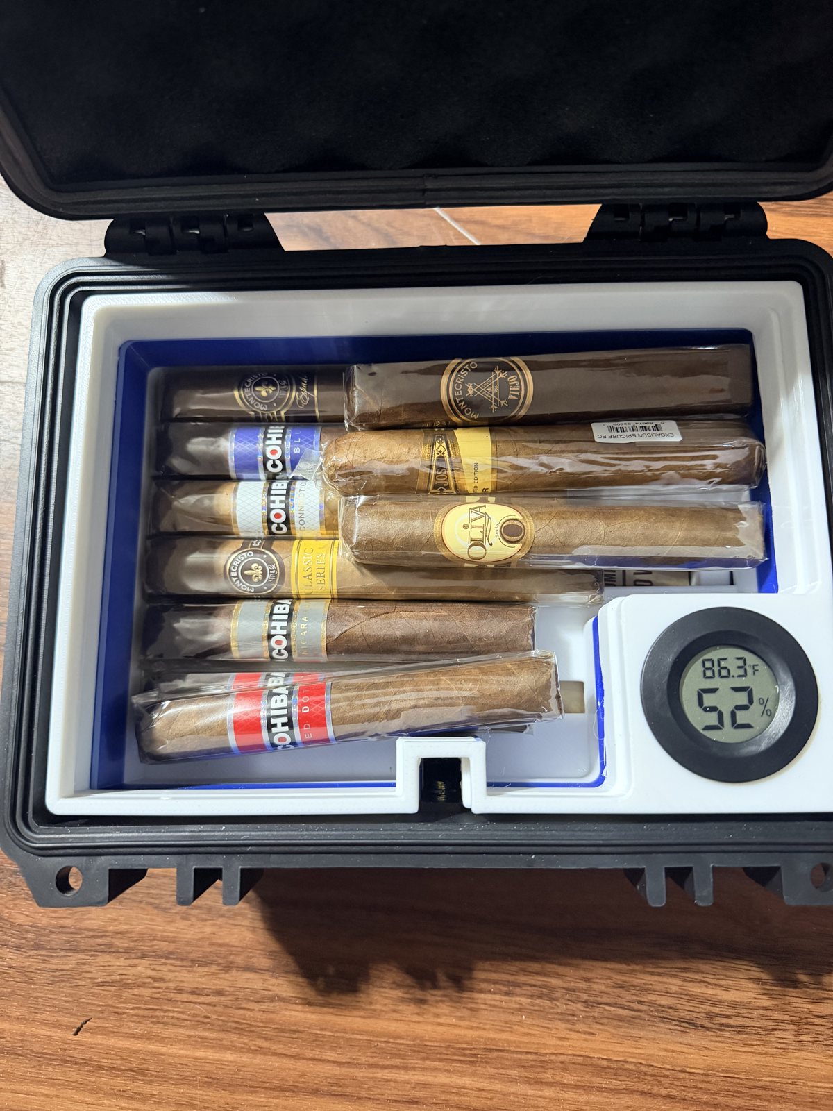 Fitted case holding small parts and a digital gauge