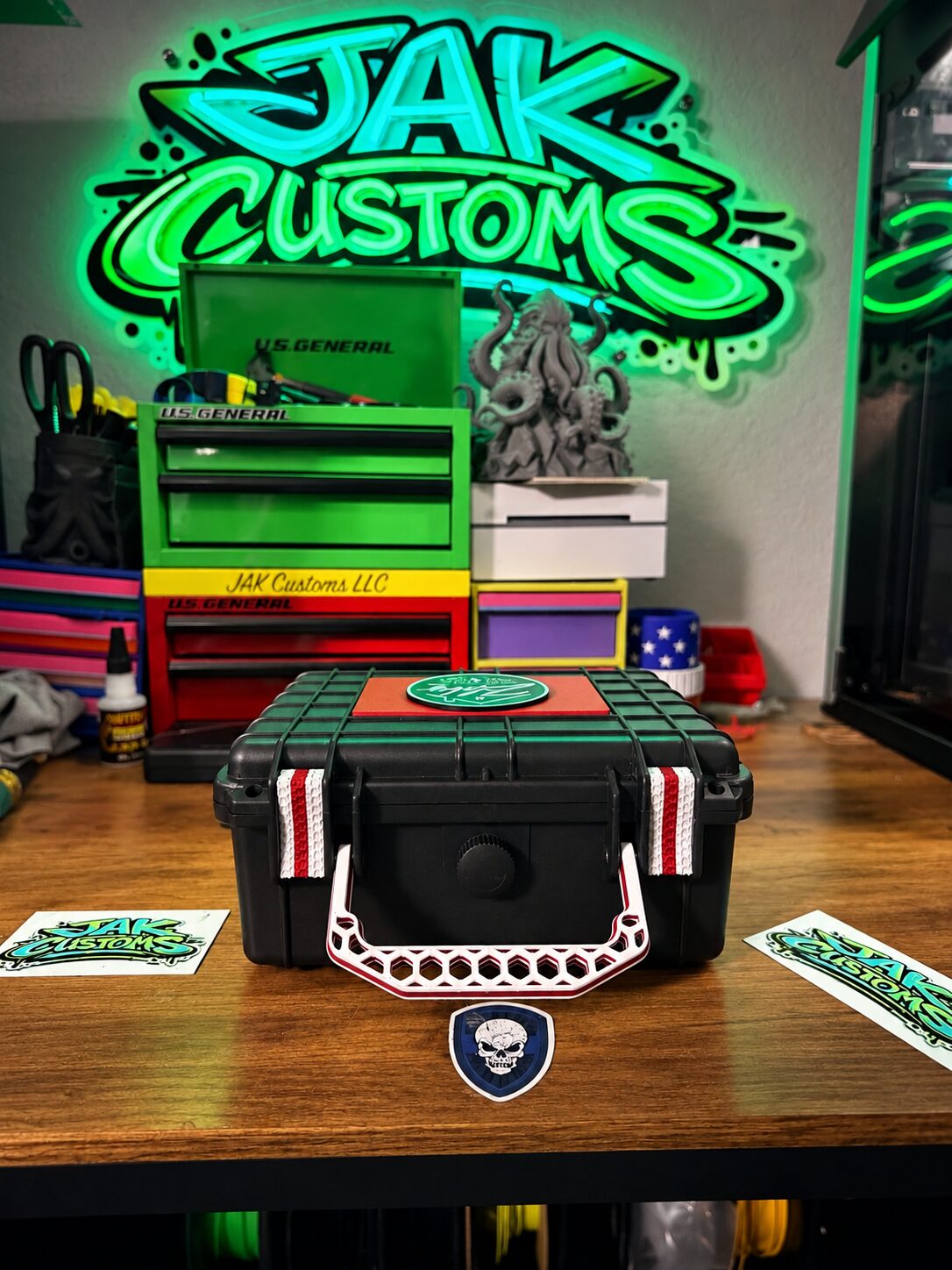 Open personalized black carry case with compartments and a red insert