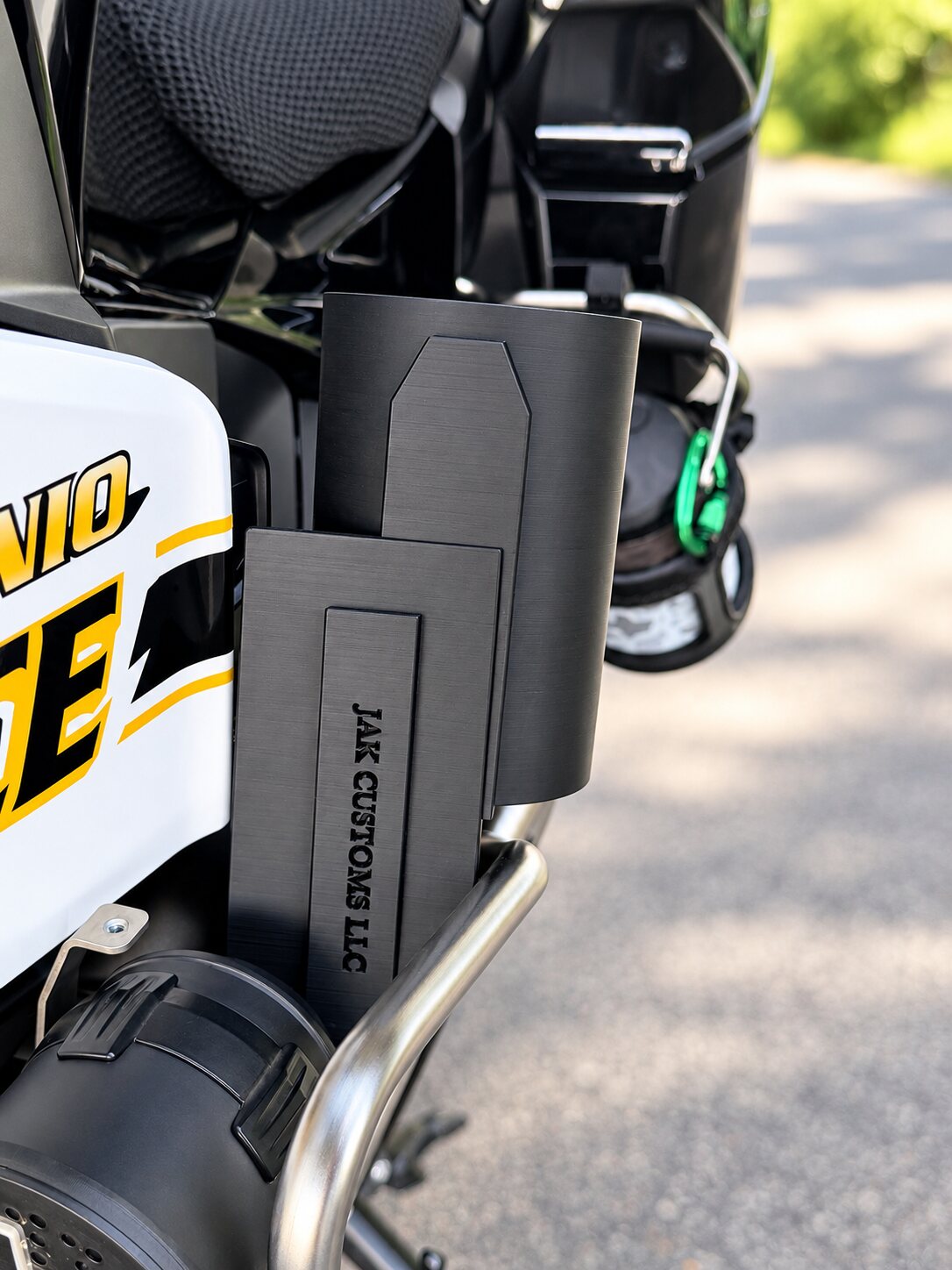 Black siren cover mounted on a police motorcycle crash bar