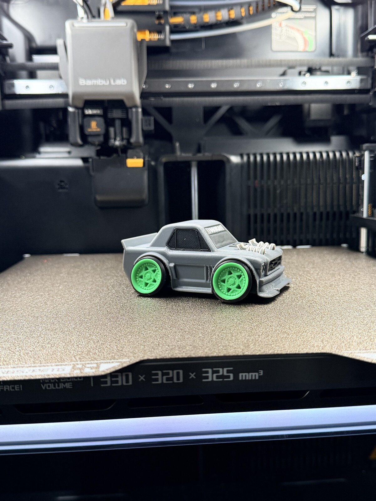 White drift car model with bright green wheels