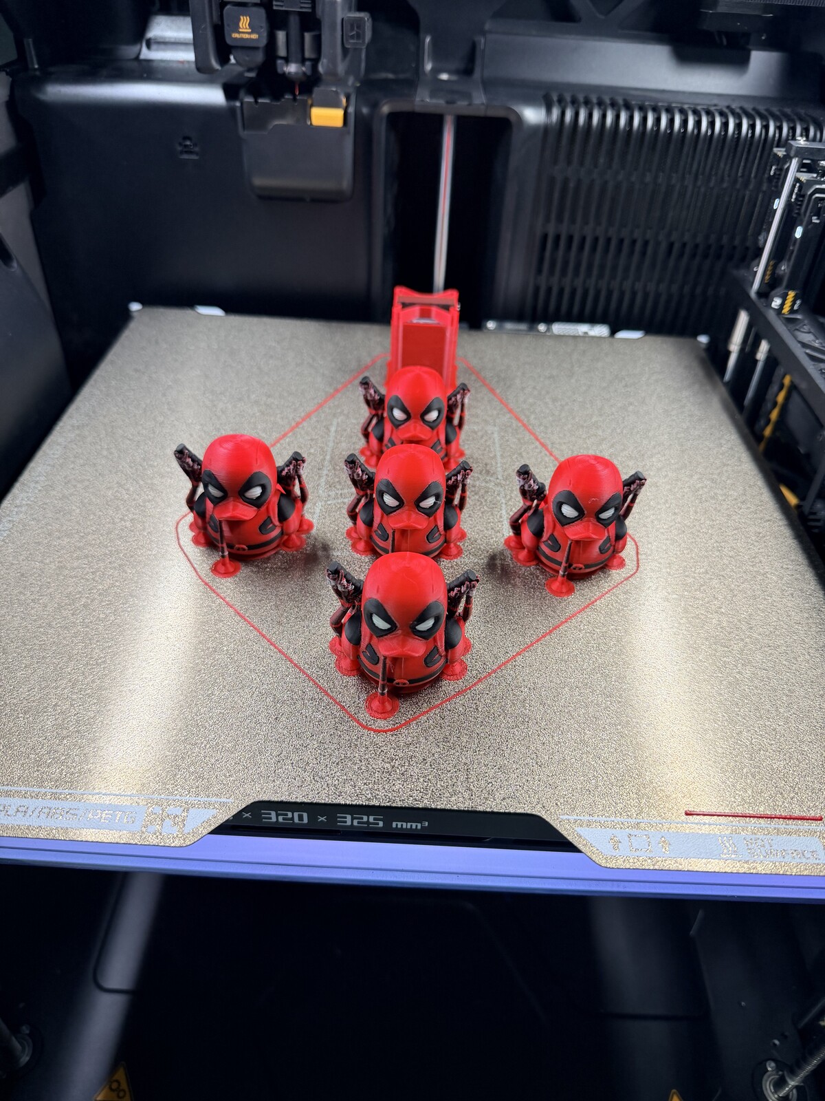 Set of small red and black mercenary figures printed as a group