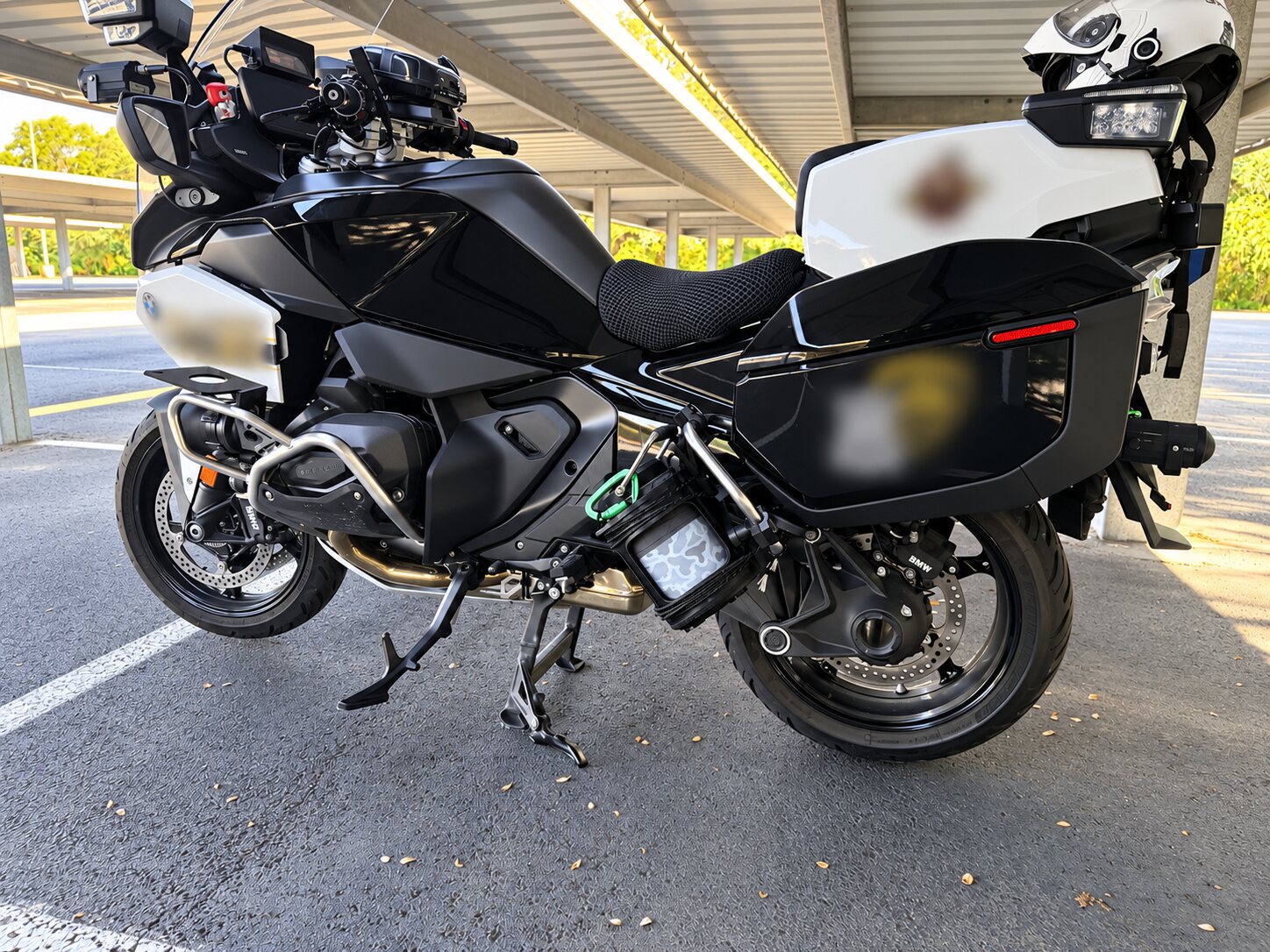 Black and white police motorcycle fully outfitted with custom gear