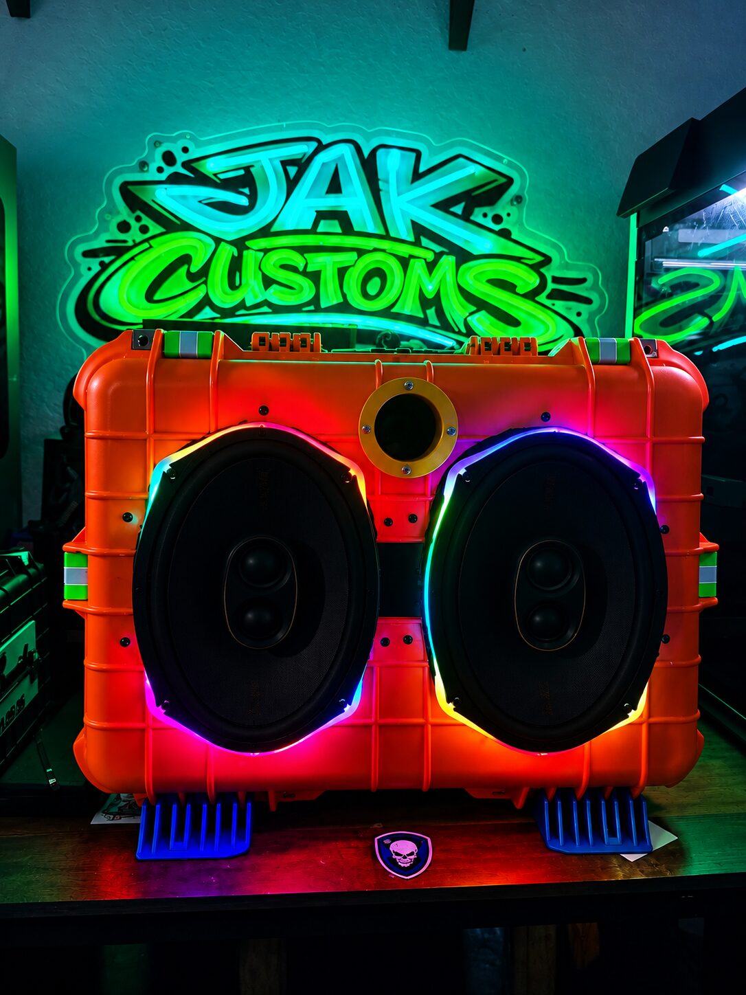Close view of dual speakers mounted in an orange custom case