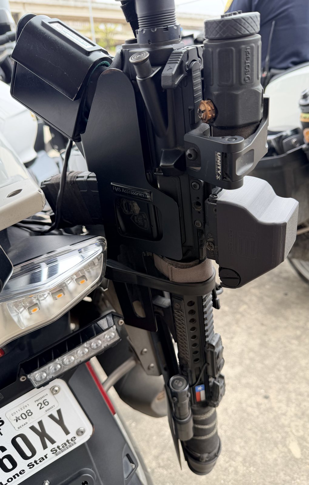 Custom part mounted on a motorcycle near the handlebars