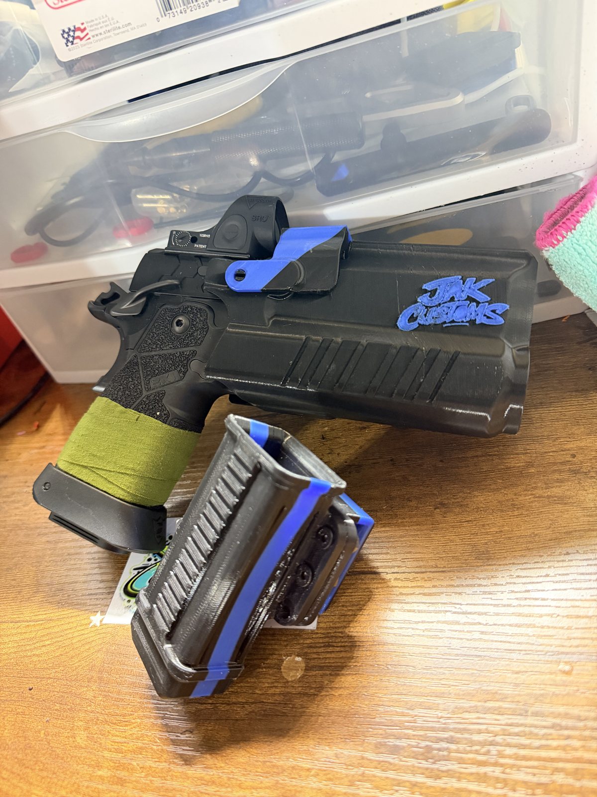 Black and blue printed equipment mounts on a workbench