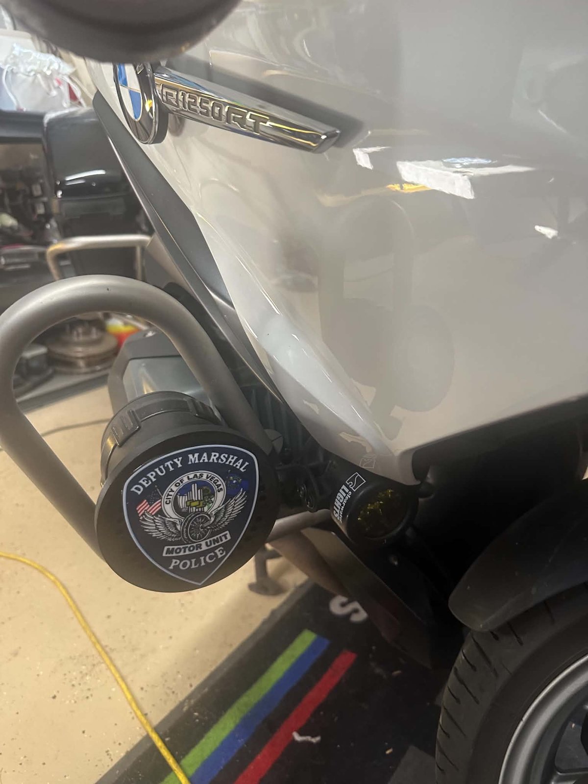 Close-up of a custom siren cover mounted on a motorcycle