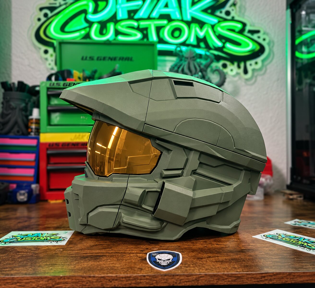 Olive green sci-fi helmet with gold visor, opposite side