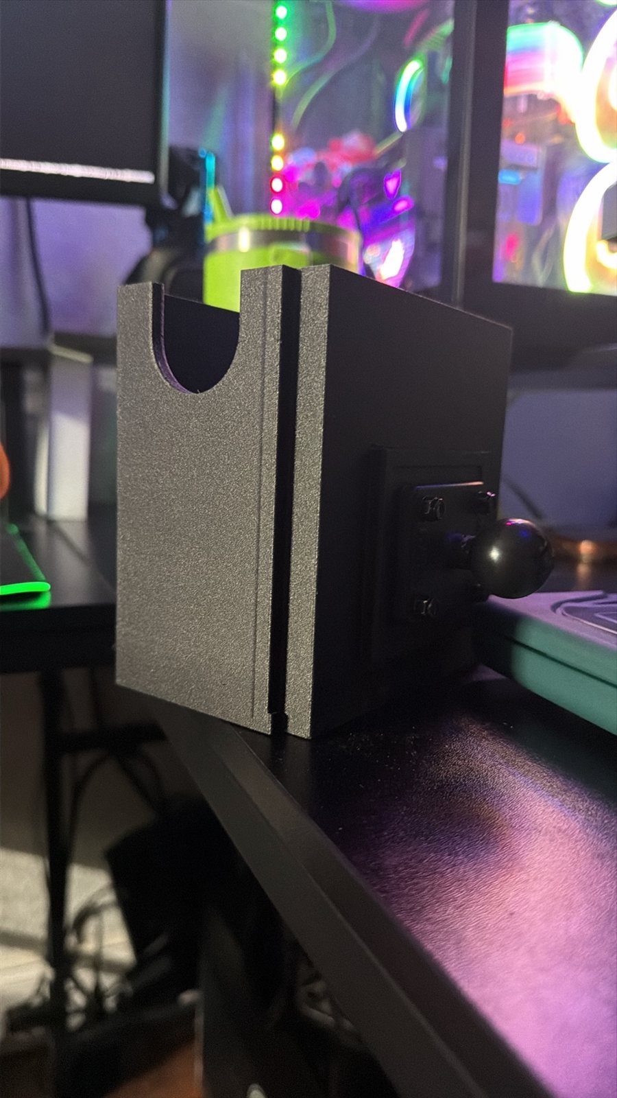 Green printed bracket fitted to a computer tower