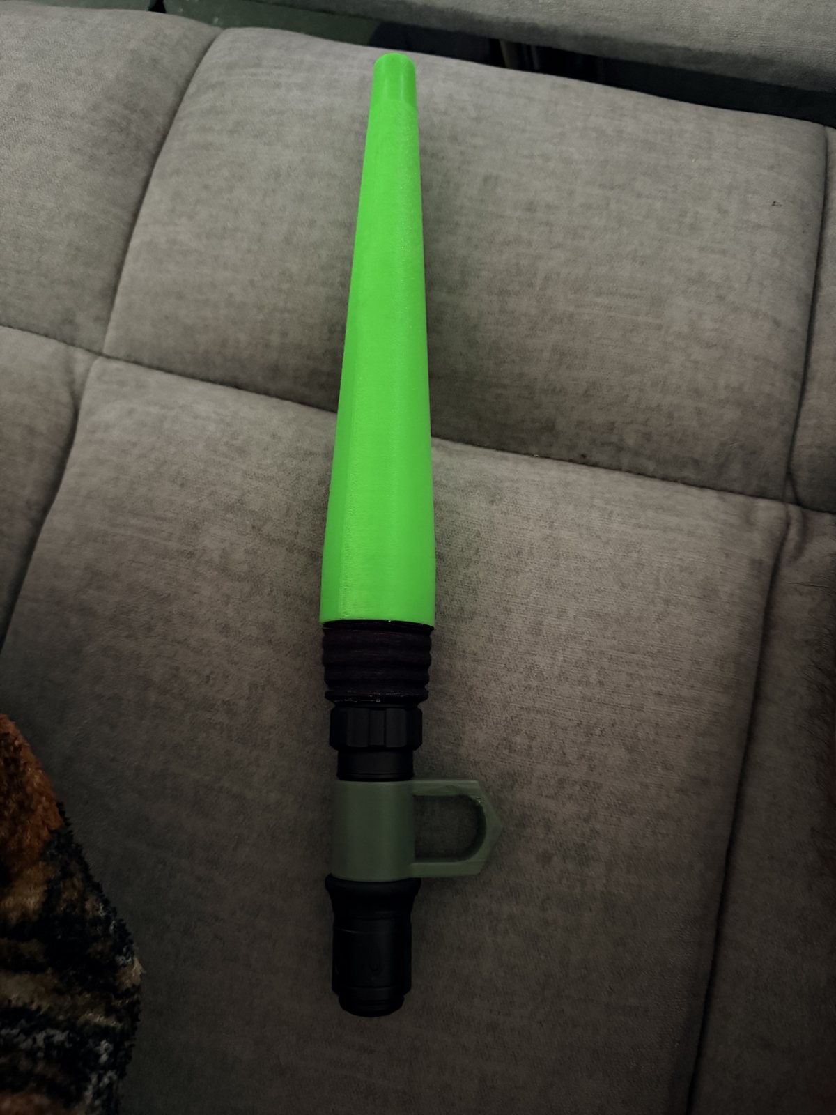 Green printed light wand shown without illumination