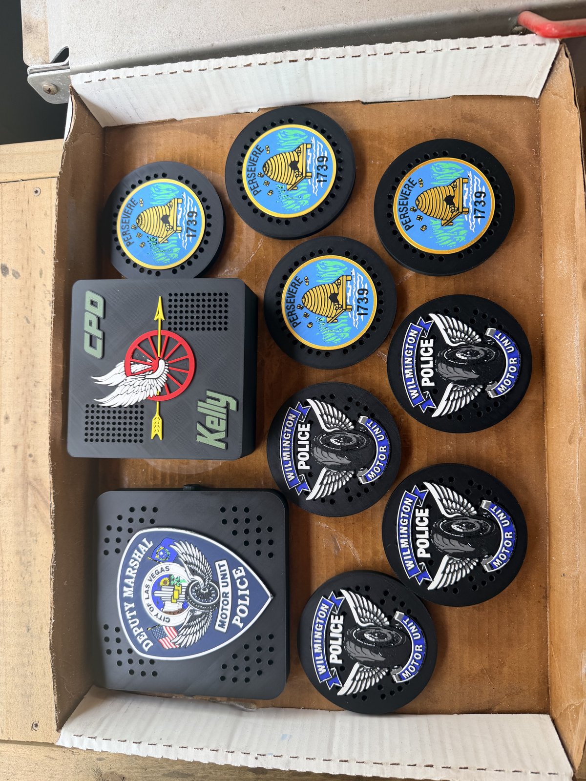 Box of custom police and motorcycle unit siren covers
