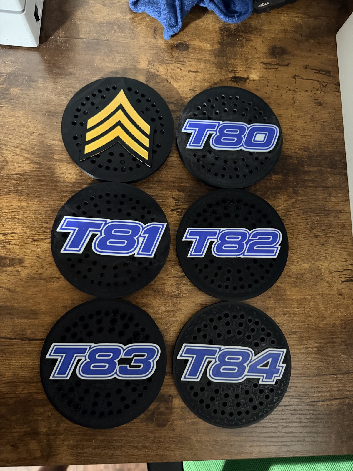 Custom siren covers with blue motorcycle unit numbers and rank chevron