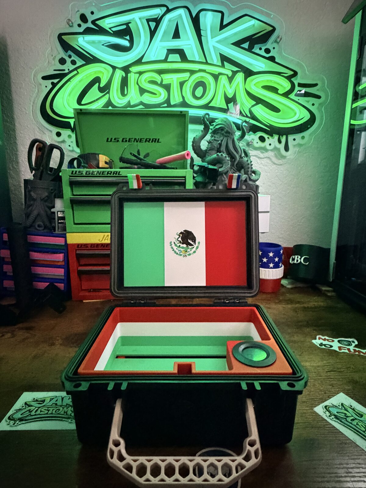 Open presentation case with a green interior and a custom emblem