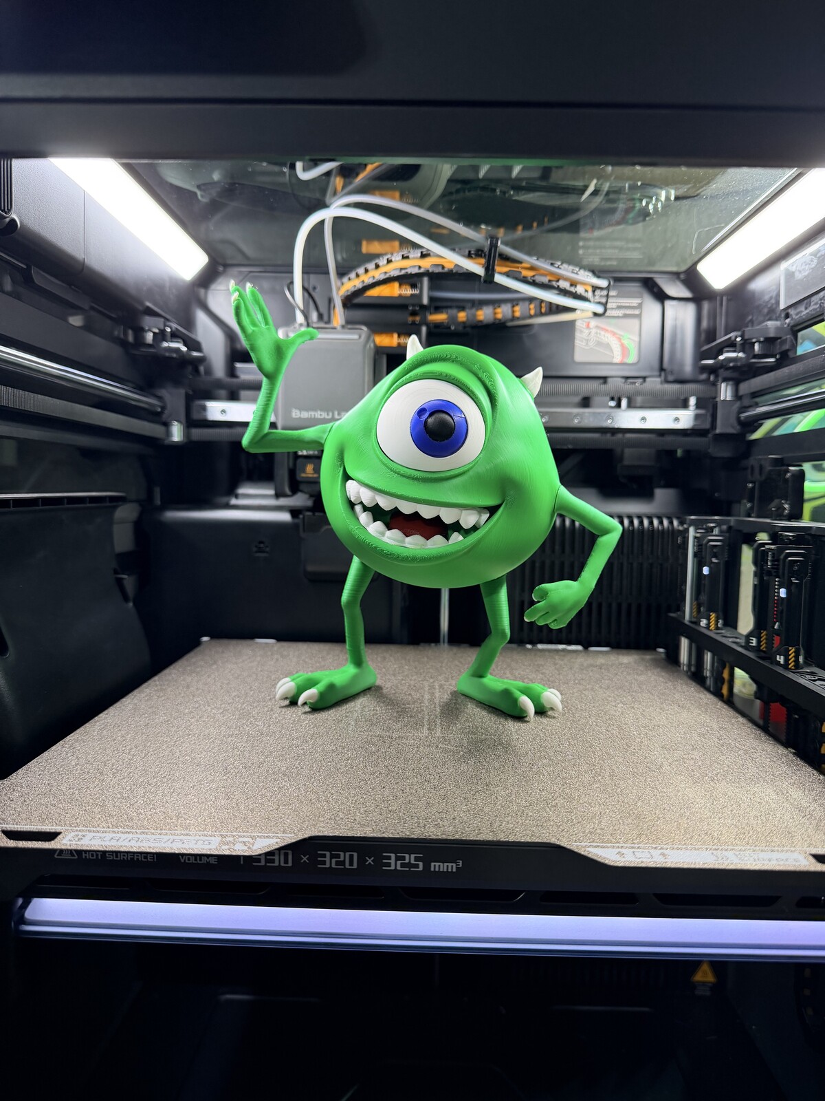 Green one-eyed monster character figure, printed and painted