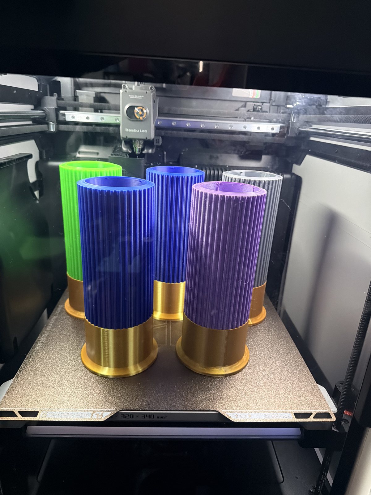 Colorful cylindrical printed accessories on the printer bed