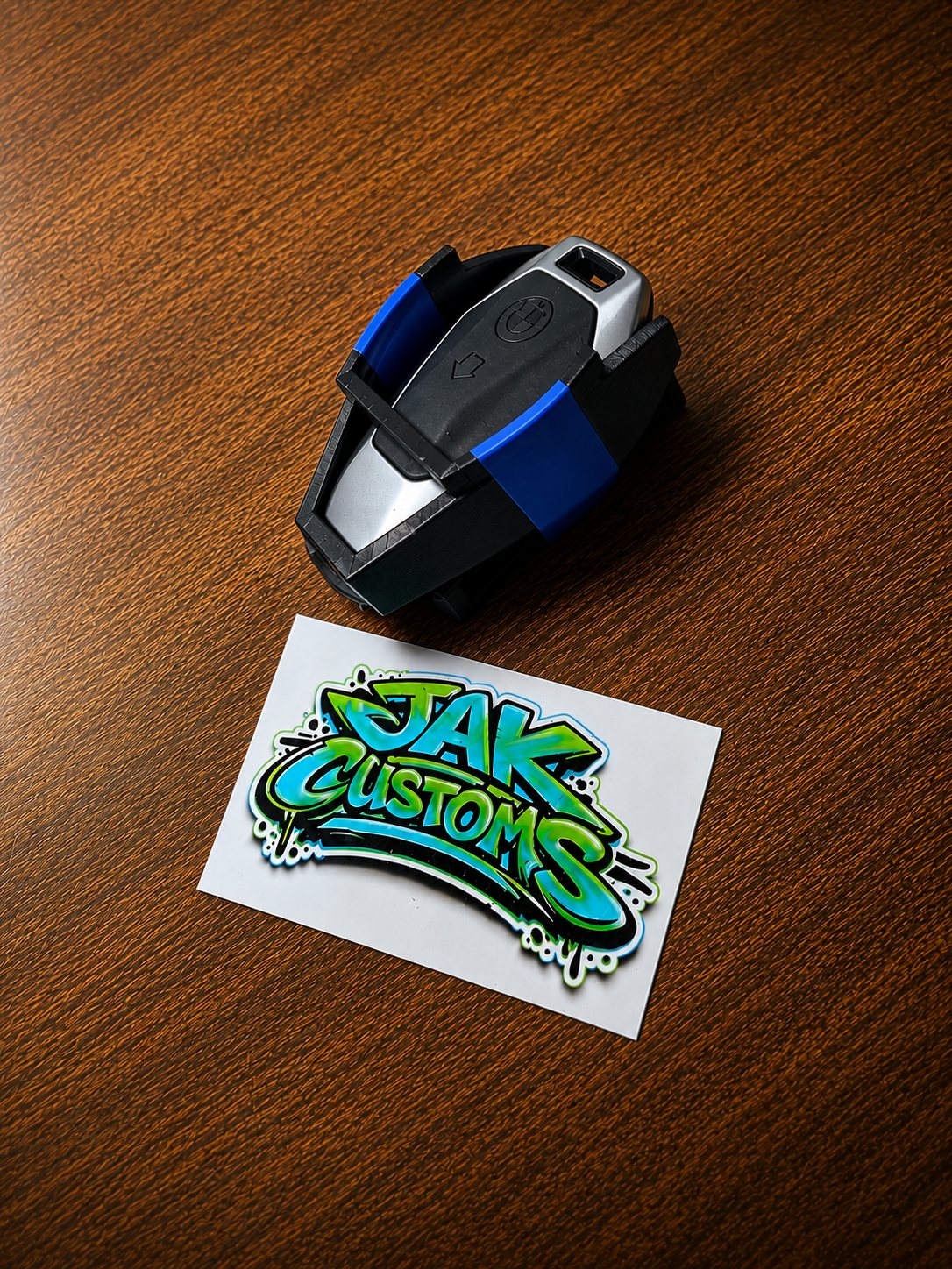 Black and blue custom printed mount shown on a tabletop