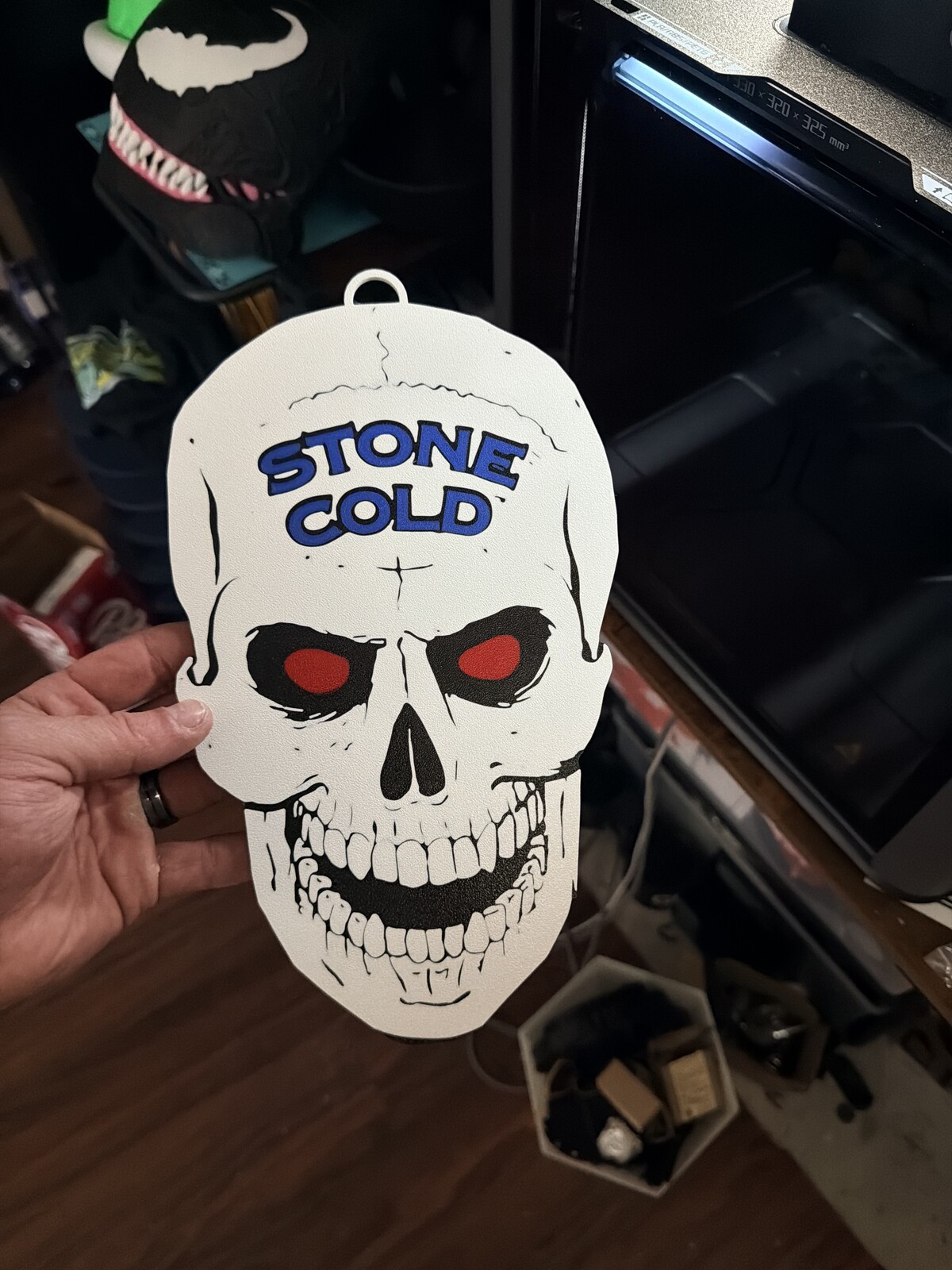 Stone Cold skull wall piece with red painted eyes