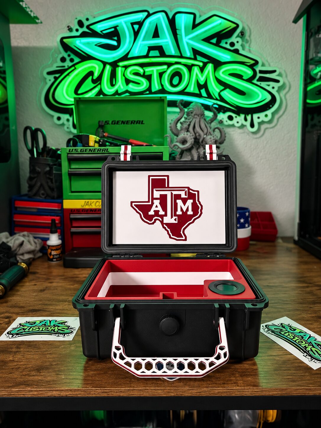 Open Texas A&M presentation case with a red fitted tray and logo lid