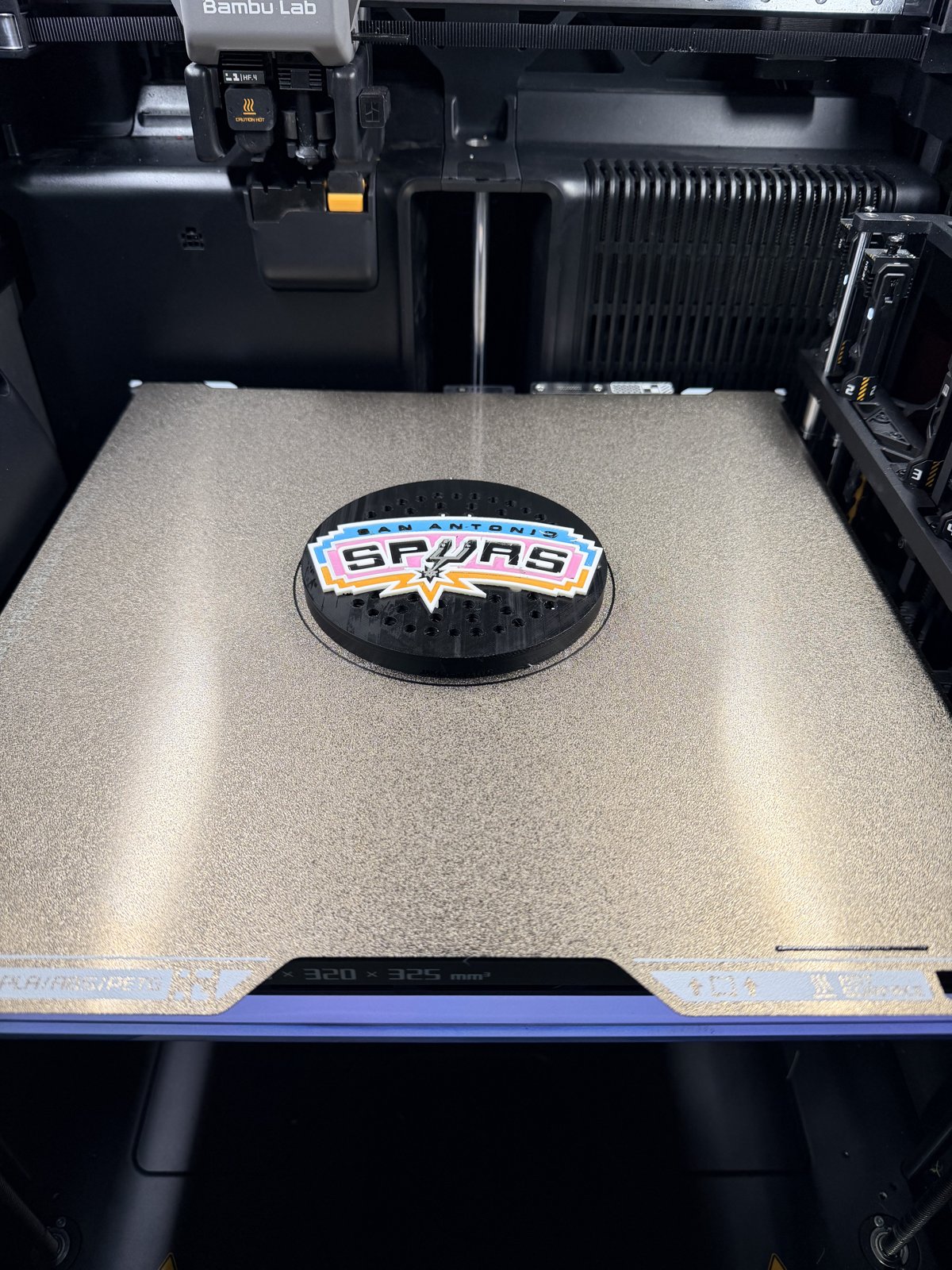 Small Spurs-themed custom siren cover on a print bed