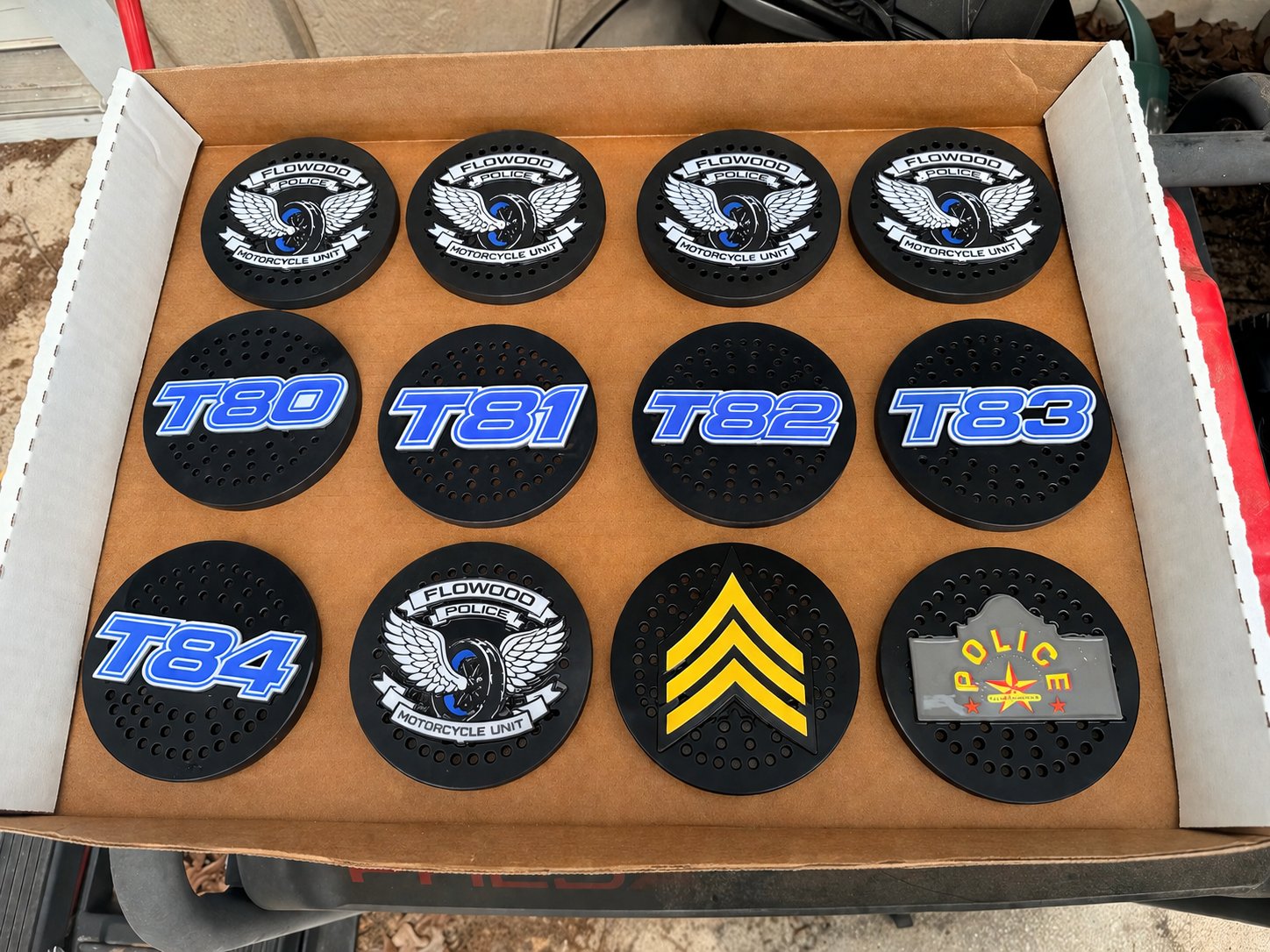 Custom siren covers with blue unit numbers and police emblems