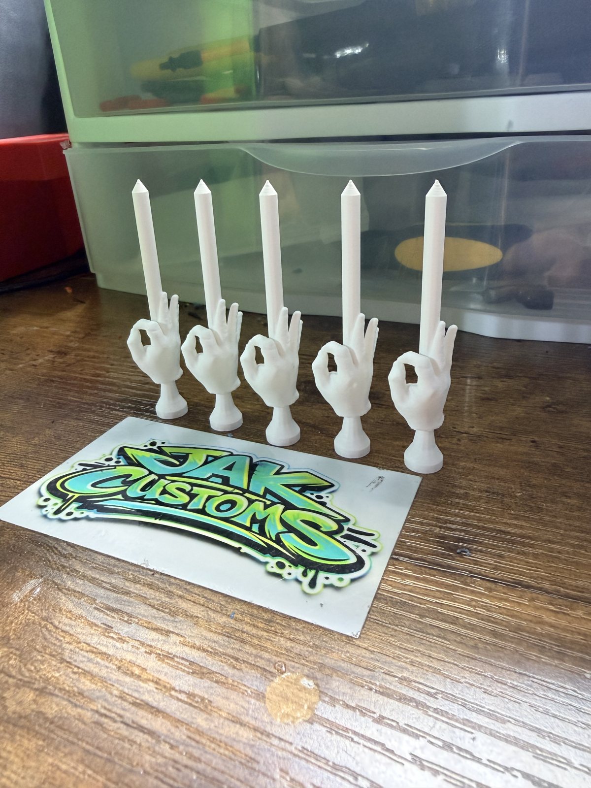 Set of white printed holders standing on a tabletop