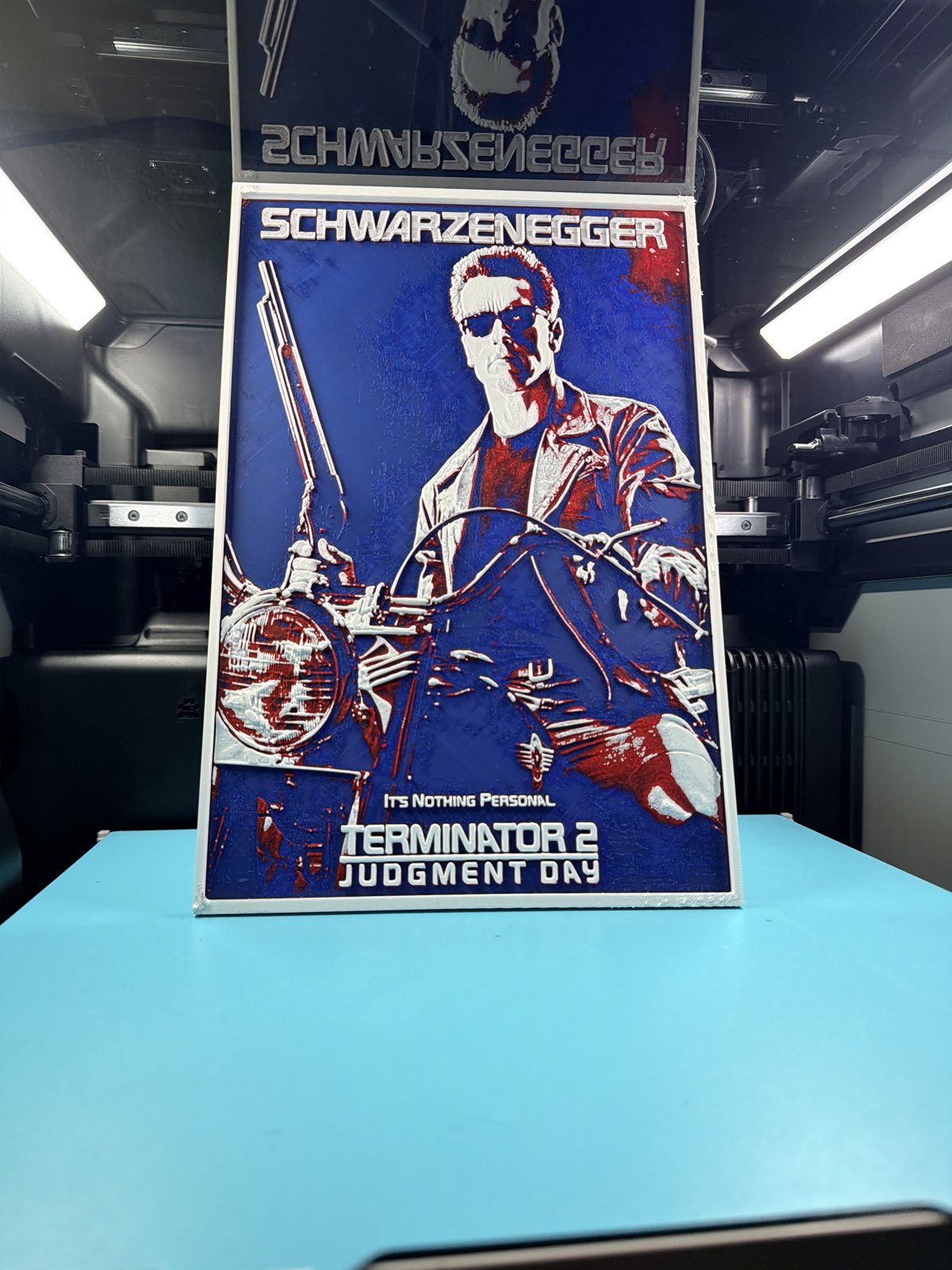 Schwarzenegger movie poster recreated as layered printed wall art