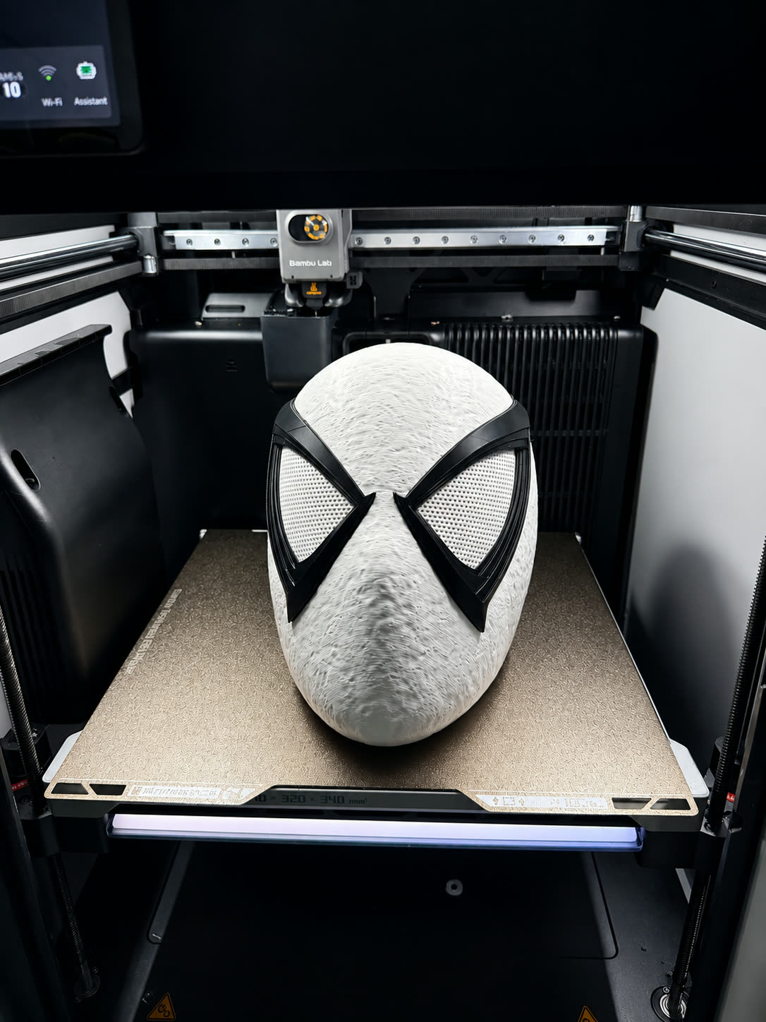 Red and black web-patterned 3D printed hero mask