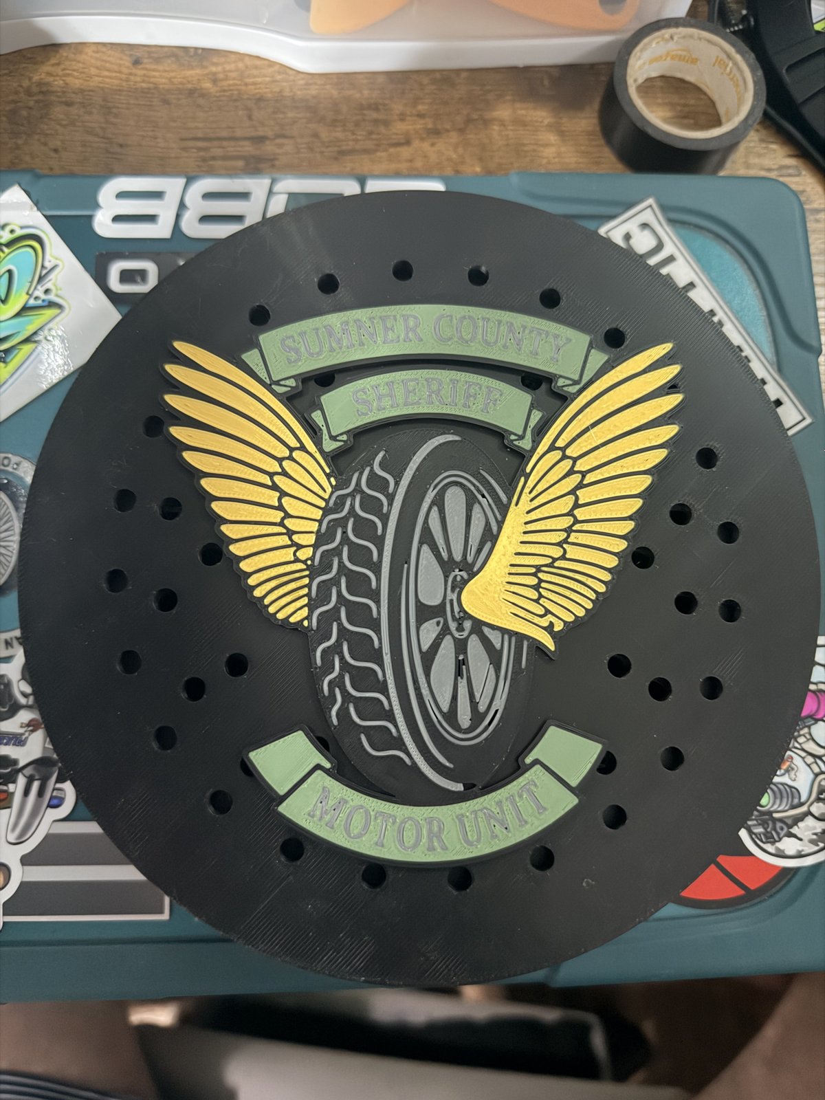 Single black siren cover with gold winged motorcycle unit emblem
