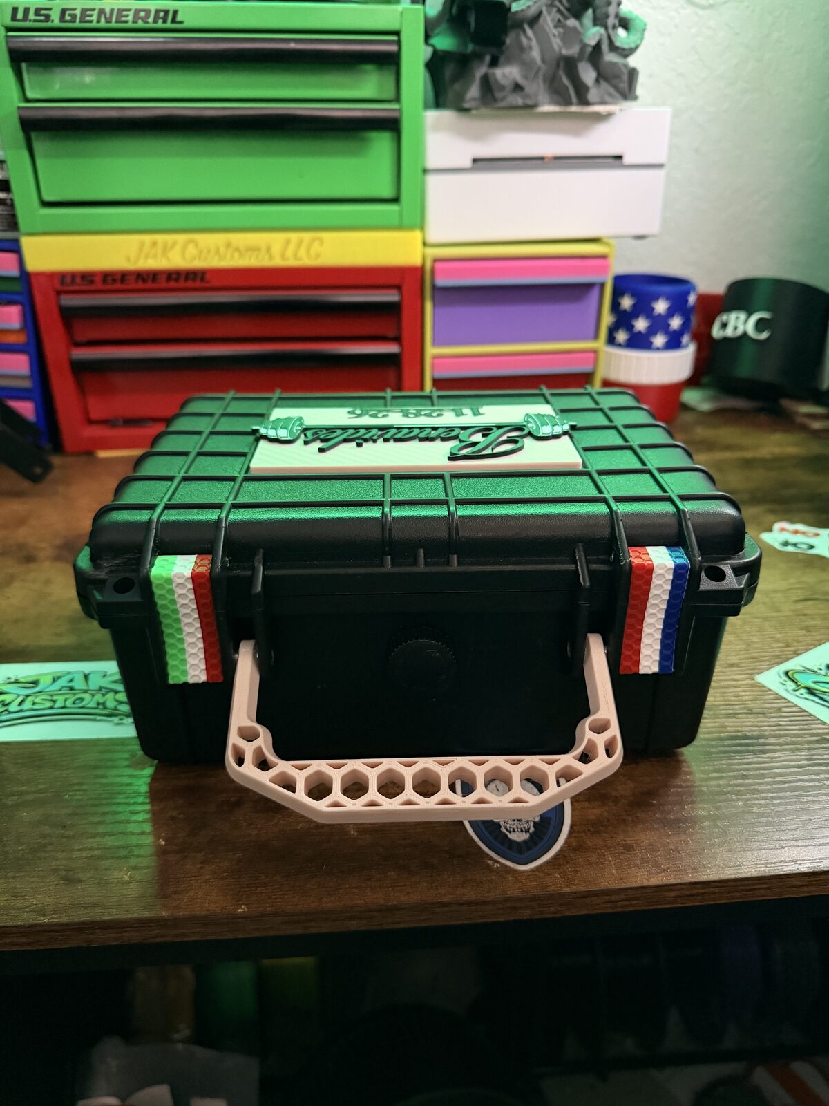 Black custom carry case with green trim and a fitted interior