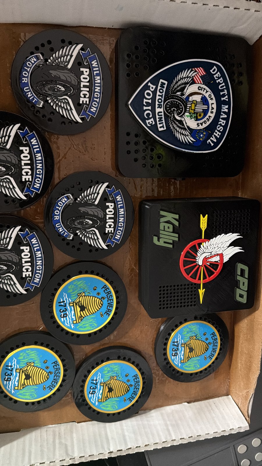 Assorted police siren covers with unit and department emblems