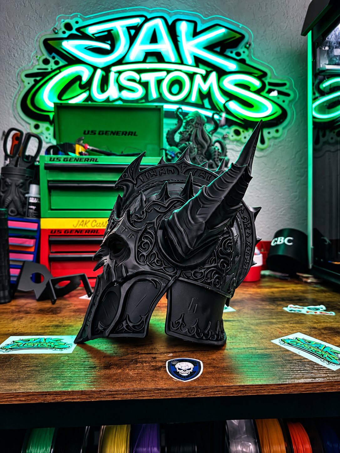 Black sculpted creature helmet, three-quarter view