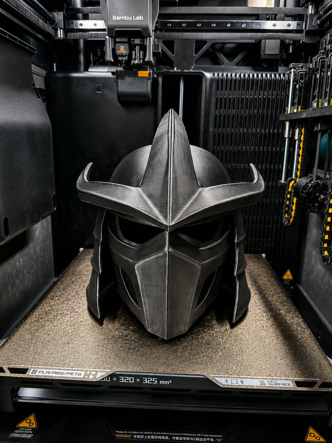 Silver spartan-style helmet with a sculpted face plate