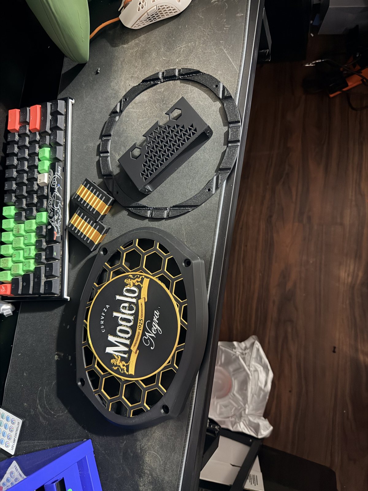 Black printed circular accessories displayed on a desk