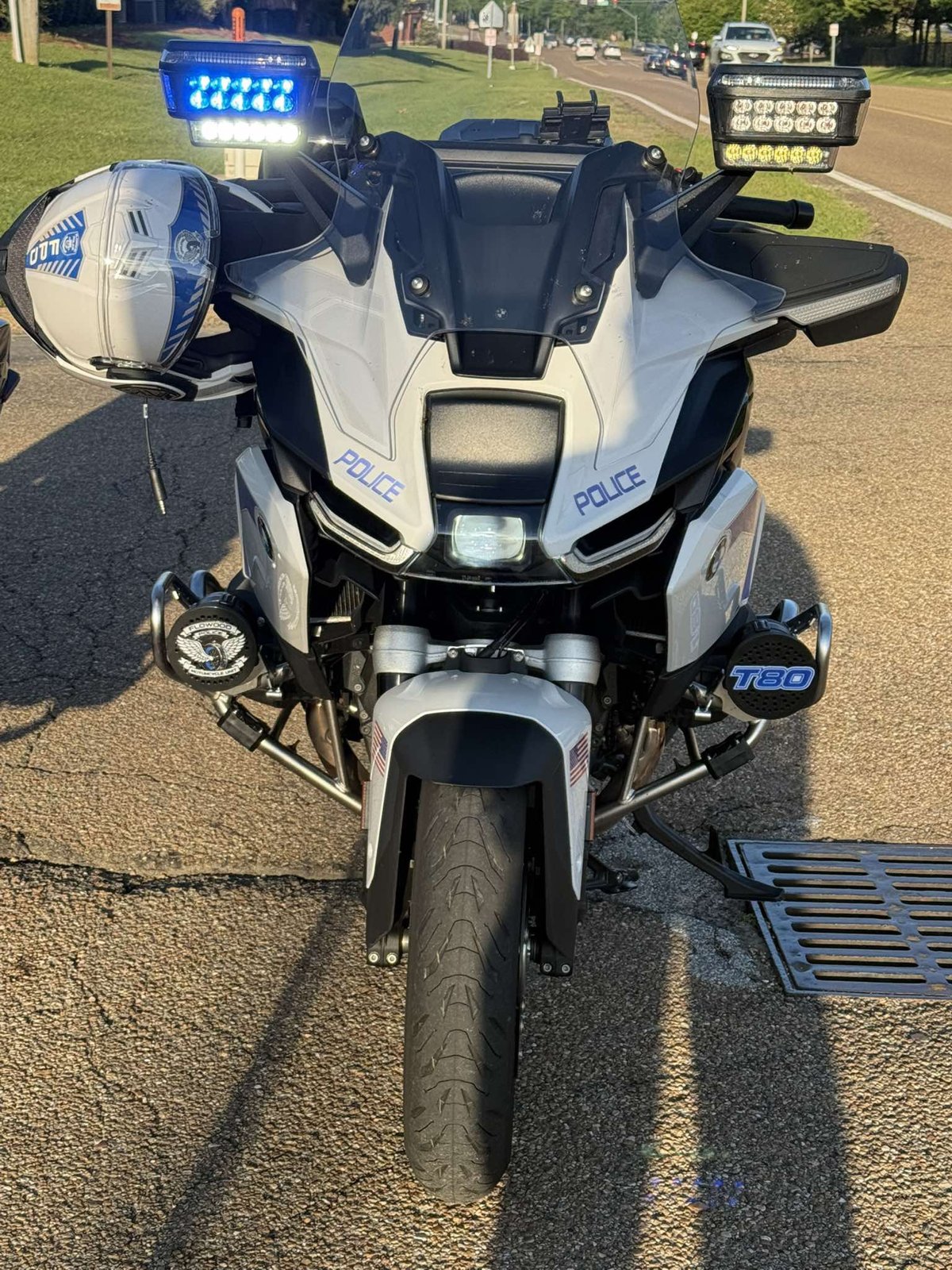 Front view of police motorcycle with mounted custom siren covers